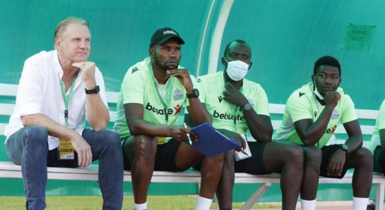 Mark Harrison (left) who had been in charge for just five months, was sent packing alongside his assistant Sammy Omollo (2nd left) and goalkeeper trainer Jerim Onyango (masked).