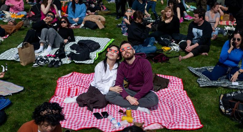 People gather at Greenwood Cemetery in Brooklyn to witness a partial solar eclipse.Pacific Press/Getty Images