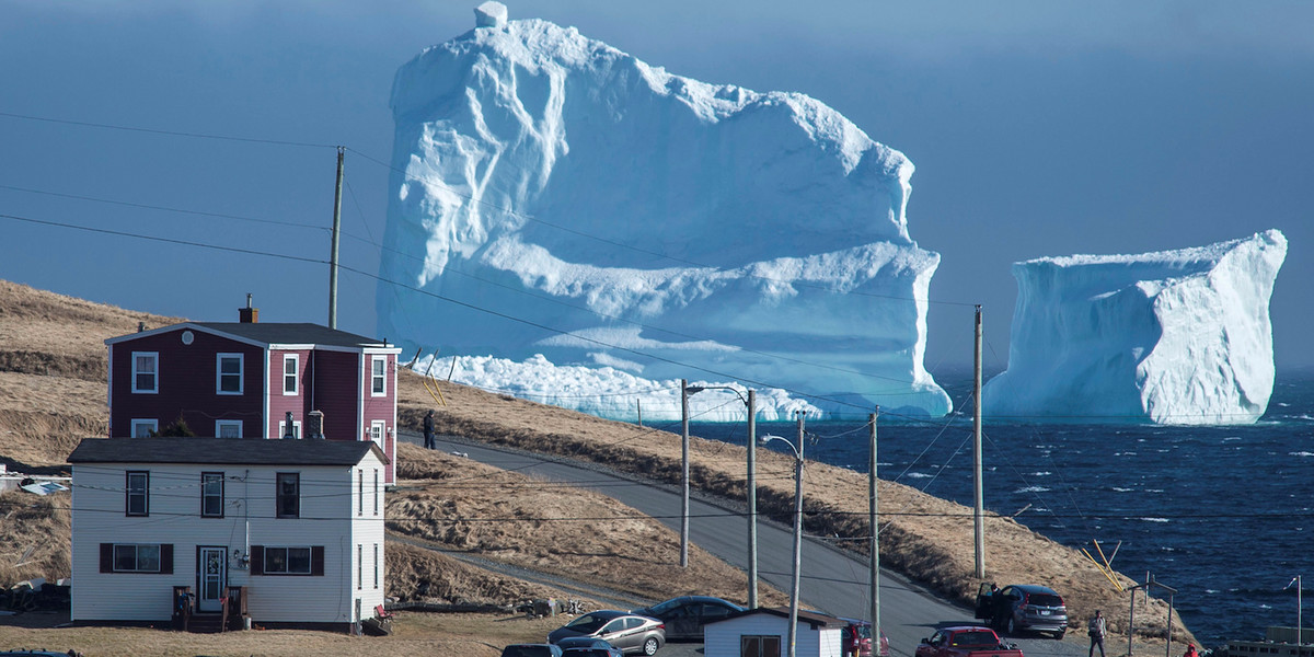 A giant iceberg spotted off the Canadian coast is attracting swarms of tourists