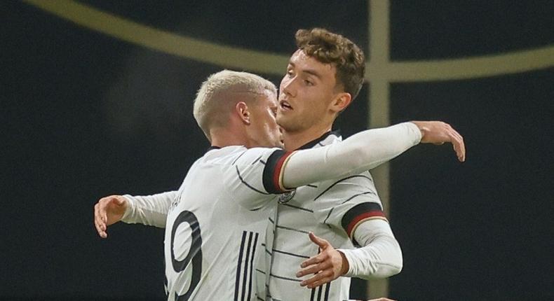 Luca Waldschmidt (R) celebrates scoring Germany's winning goal in Leipzig