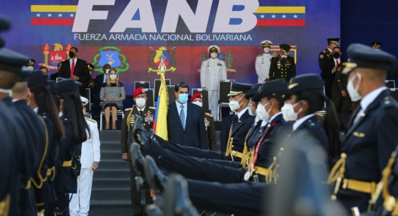 Venezuela President Nicolas Maduro (center) takes part in a ceremony to hand out promotions to military officers