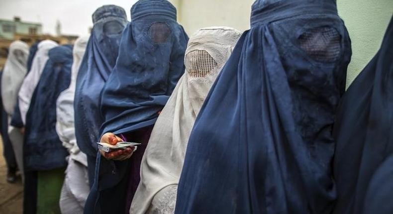 Afghan women stand in line while waiting for their turn to vote at a polling station in Mazar-i-sharif April 5, 2014. REUTERS/Zohra Bensemra