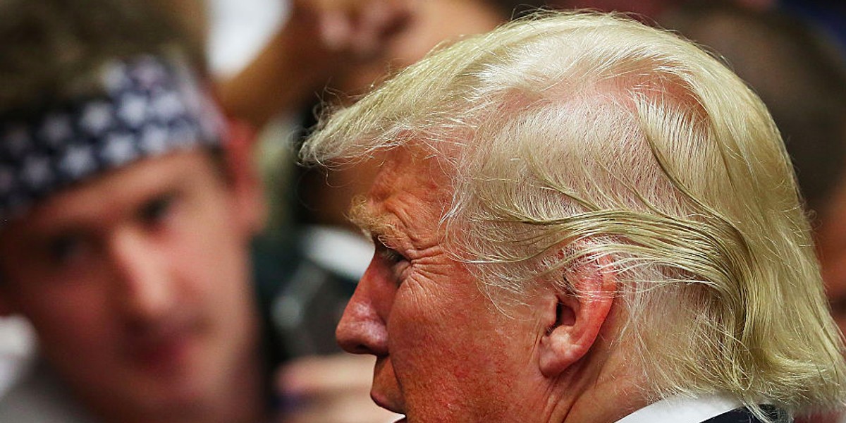 Republican presidential candidate Donald Trump signs autographs after speaking at a rally in San Diego on May 27, 2016 in San Diego, California.