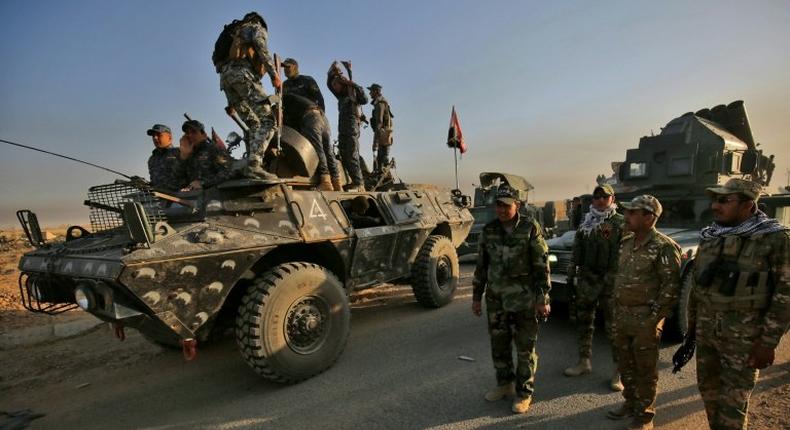 Iraqi forces gather near al-Shourah before launching an offensive to retake Mosul from the Islamic State (IS) group