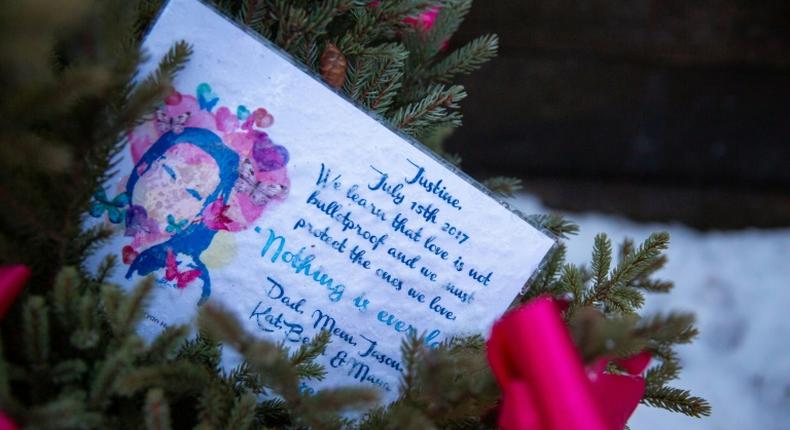 A memorial for Justine Damond is seen near the alleyway were she was found dead in Minneapolis on December 28, 2018 -- a policeman accused of murdering the Australian in the Minnesota city is about to face trial