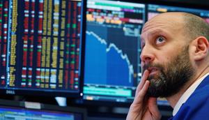 A trader reacts as he watches screens on the floor of the New York Stock Exchange in New YorkReuters/Brendan McDermid