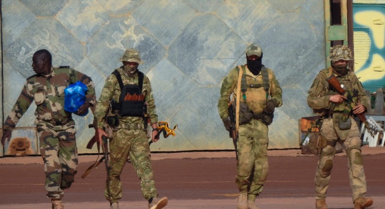 This undated photograph handed out by French military shows three Russian mercenaries, right, in northern Mali.French Army via AP