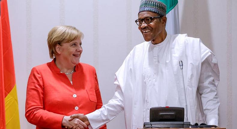 President Buhari in a handshake with German Chancellor Merkel at the State House (Thisday)