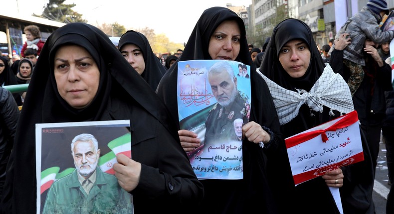 Mourners holding posters of Iranian Gen. Qassem Soleimani attend a funeral ceremony for him and his comrades, who were killed in Iraq in a U.S. drone strike on Friday, at the Enqelab-e-Eslami (Islamic Revolution) Square in Tehran, Iran, Monday, Jan. 6, 2020. The processions mark the first time Iran honored a single man with a multi-city ceremony. Not even Ayatollah Ruhollah Khomeini, who founded the Islamic Republic, received such a processional with his death in 1989. Soleimani on Monday will lie in state at Tehran's famed Musalla mosque as the revolutionary leader did before him. (AP Photo/Ebrahim Noroozi)