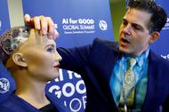David Hanson of Hanson Robotics presents Sophia, a robot integrating the latest technologies and artificial intelligence is pictured during a presentation at the AI for Good Global Summit in Geneva