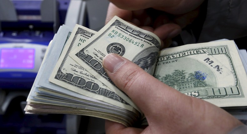 A money changer counts U.S. dollar bills at a currency exchange office in central Istanbul April 15, 2015.Murad Sezer/Reuters