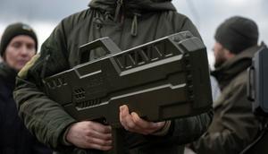 A man holds a portable electronic warfare system at an event in Ukraine earlier this year.Global Images Ukraine via Getty