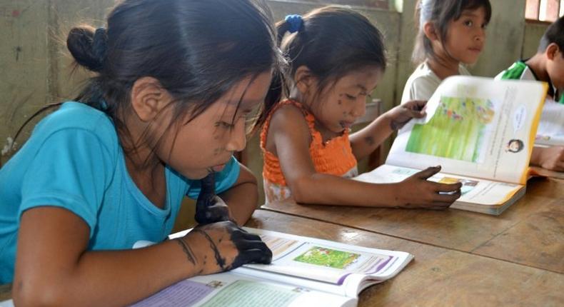 Amazonian children take part in activities designed to practice their native language in an effort to assure the continuity of their cultural heritage in Tingo Maria, Peru