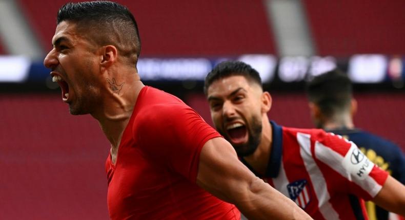 Late joy: Luis Suarez celebrates the late winner that preserved Atletico Madrid's Liga lead Creator: GABRIEL BOUYS