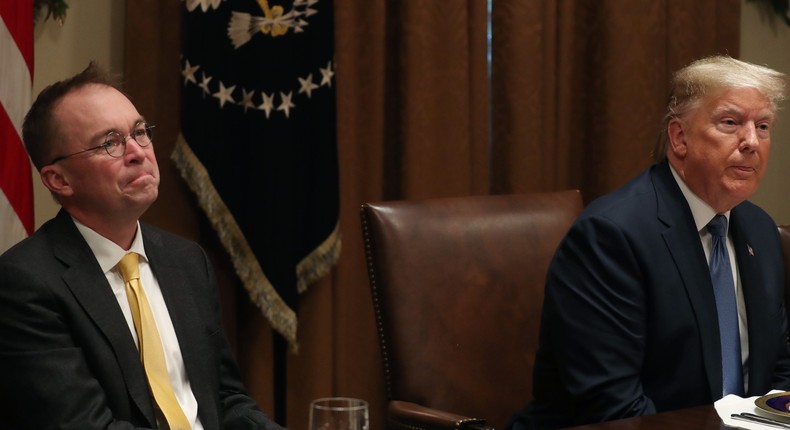 WASHINGTON, DC - DECEMBER 05: U.S. President Donald Trump (R) and Acting chief of staff Mick Mulvaney (L) listen to comments during a luncheon with representatives of the United Nations Security Council, in the Cabinet Room at the White House on December 5, 2019 in Washington, DC.