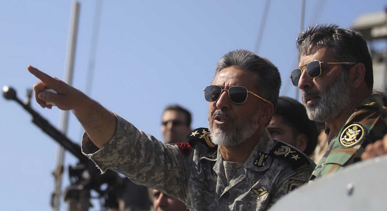 Iran's Navy commander Habibollah Sayyari (C) points while standing on a naval ship during Velayat-90 war game on Sea of Oman near the Strait of Hormuz in southern Iran January 1, 2012.