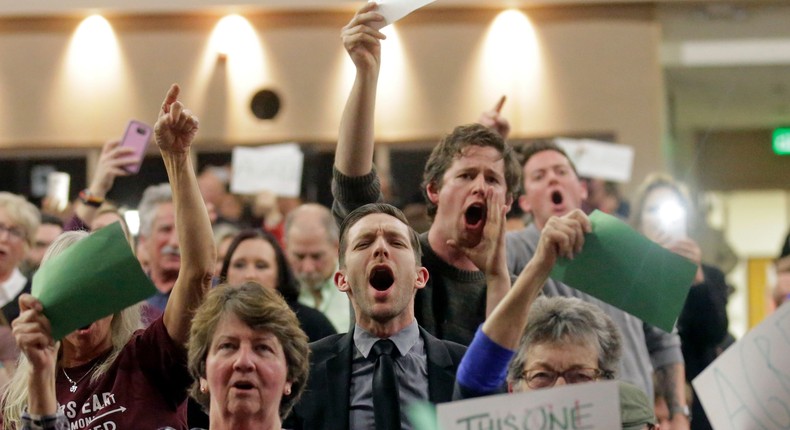 People shouting to Rep. Jason Chaffetz during his town-hall meeting at Brighton High School on February 9 in Cottonwood Heights, Utah.