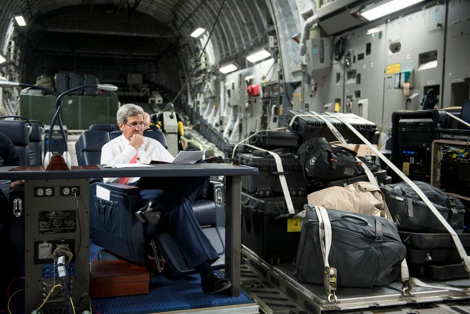 JORDAN: Kerry looks over papers while flying in a military plane on his way to visit Jordan and Iraq on September 10, 2014.