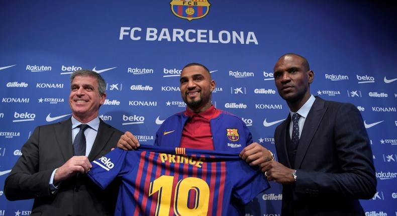 Kevin-Prince Boateng (C) is unveiled by Barcelona after joining the club on loan for the rest of the season