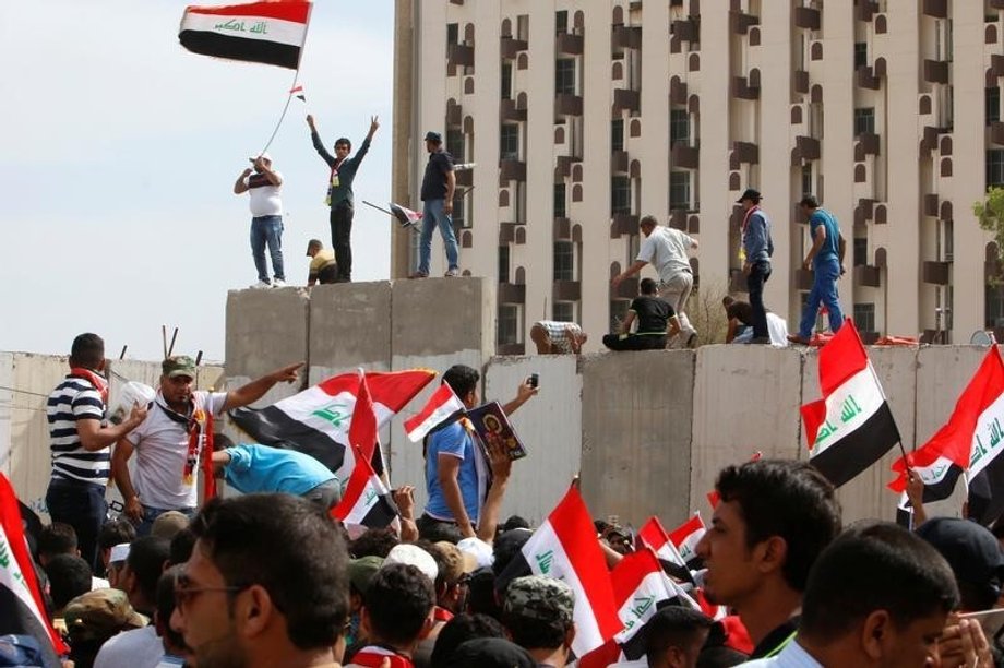 Followers of Iraq's Shi'ite cleric Moqtada al-Sadr storm Baghdad's Green Zone after lawmakers failed to convene for a vote on overhauling the government, in Iraq April 30, 2016.