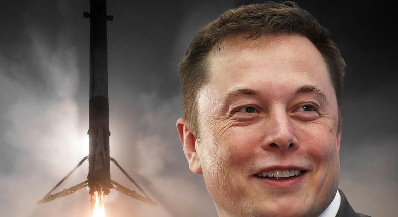 Elon Musk and one of SpaceX's self-landing Falcon 9 rocket boosters.