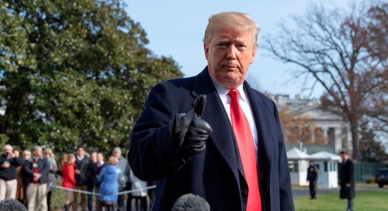 US President Donald Trump talks to reporters prior to boarding Marine One as he departs the White House in Washington, DC on December 8, 2018. - US President Donald Trump on Saturday announced his chief of staff John Kelly would be leaving the administration at the end of the year -- the latest in a series of moves by the Republican leader to change his inner circle of aides.