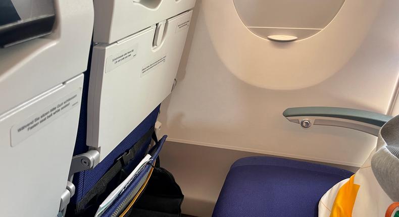The foot hammock attached to an airplane seat.Monica Humphries/Business Insider