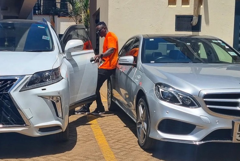 Oga Obinna having a look at his cars. He got a new car recently