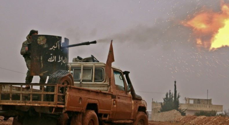 Syrian opposition fighters fire towards positions held by Islamic State (IS) group jihadists in al-Bab on December 13, 2016