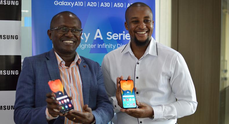 Samsung Electronics East Africa Head  of Internet and Mobile department Charles Kimari (left) and Ryan Mule, Product Marketing Manager (right) during the launch of the galaxy A series phone.