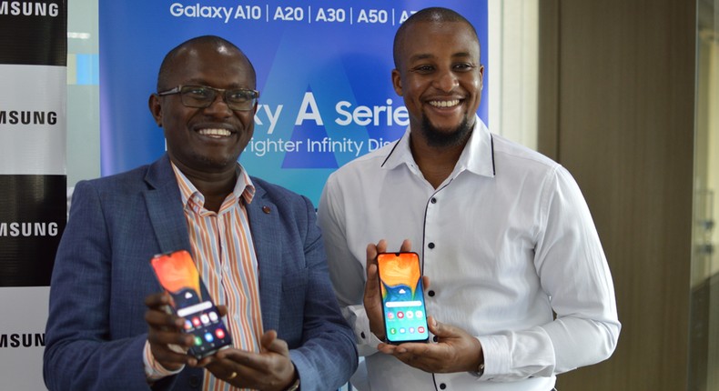 Samsung Electronics East Africa Head  of Internet and Mobile department Charles Kimari (left) and Ryan Mule, Product Marketing Manager (right) during the launch of the galaxy A series phone.