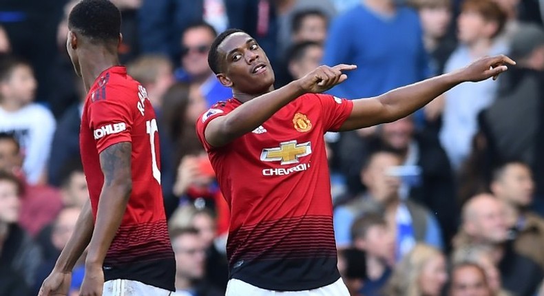 Manchester United forward Anthony Martial (right) celebrates his second goal against Chelsea