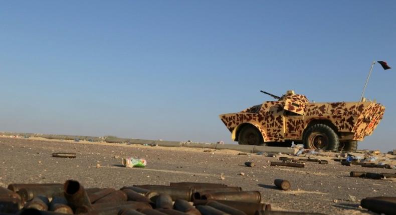 A military vehicle used by fighters from the pro-government forces loyal to Libya's Government of National Unity (GNA) is seen near ammunition casing on August 3, 2016 in Sirte during an operation against jihadists of the Islamic State group 