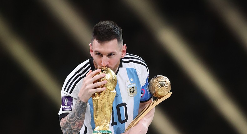 Lionel Messi with the World Cup trophy after leading Argentina to victory against France in the final in Qatar