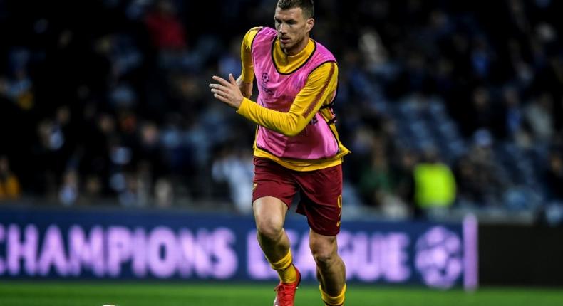 Edin Dzeko (pictured March 6, 2019) was presented with a shirt bearing the number 100 to mark his becoming the first Bosnian player to reach 100 international caps