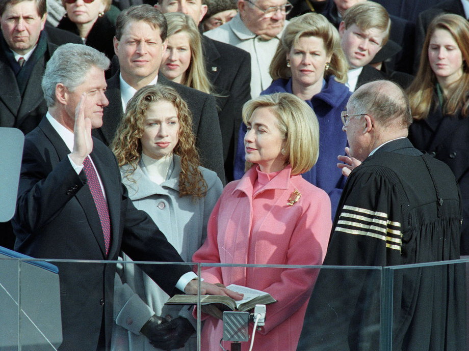 President Clinton takes the oath of office as first lady Hillary Rodham Clinton looks on.