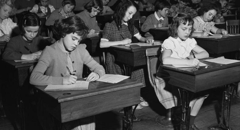 Children attending free public school, much to the delight of their parents' wallets.Archive Photos