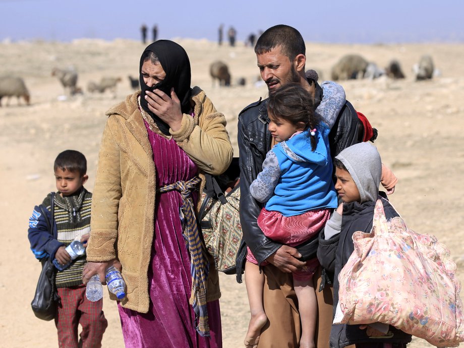 Displaced Iraqis flee their homes during a battle with ISIS militants, in district of Maamoun in western Mosul, Iraq, February 23, 2017.