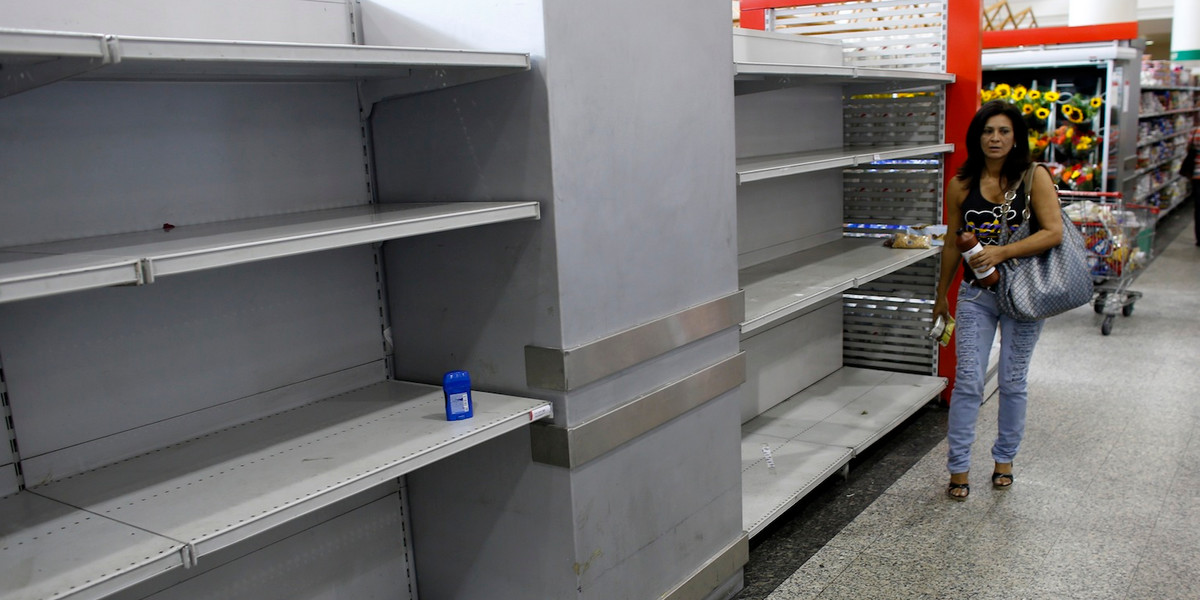 An empty section where toilet paper should be on display in a supermarket in Caracas, Venezuela, in 2013.