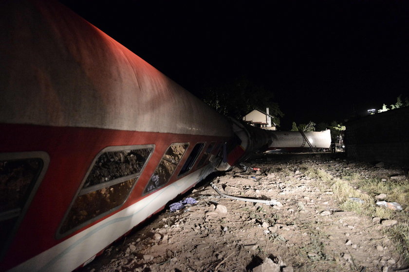 A derailed train carriage is seen toppled in the town of Adendro in northern Greece