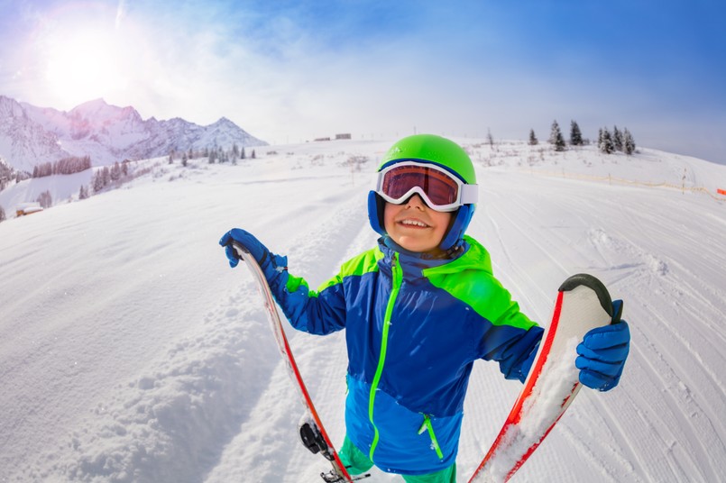 Happy,Boy,On,Skiing,Slope,Hold,Ski,Look,Up,Smiling