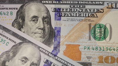 100 dollar bills seen displayed.(Photo Illustration by Sheldon Cooper/SOPA Images/LightRocket via Getty Images)