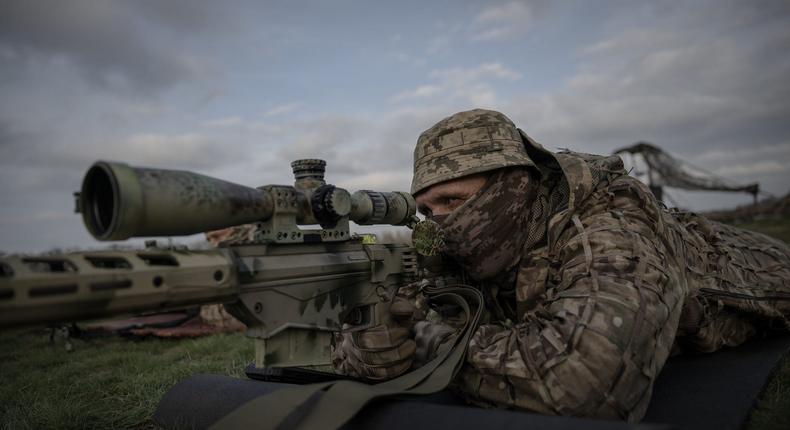 A sniper from the 108th Territorial Defense Brigade of the Ukrainian Army takes aim during military training near the frontline in Ukraine in November 2023.Ozge Elif Kizil/Anadolu via Getty Images