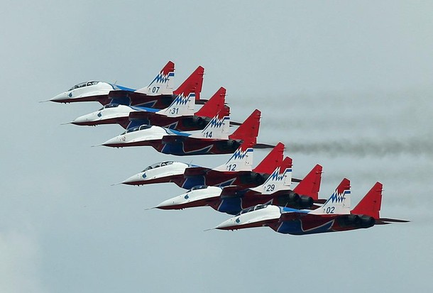 Mikoyan MiG-29 jet fighters of Strizhi aerobatic team fly in formation during International Army Gam