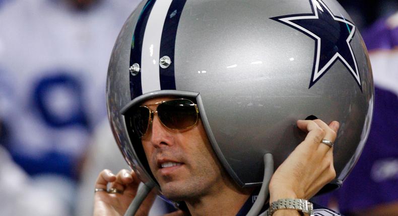 A Dallas Cowboys fan wears a giant helmet before the Cowboys play the Minnesota Vikings in their NFL Divisional playoff football game in Minneapolis, Minnesota, January 17, 2010.