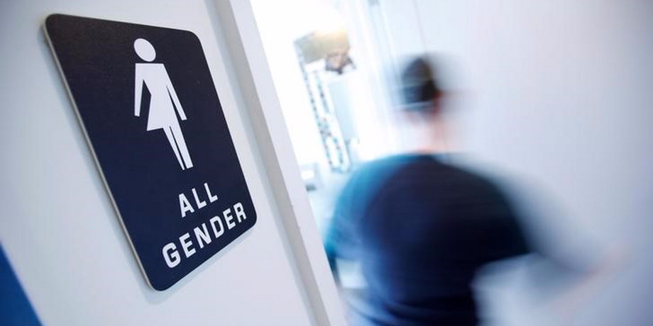 A bathroom sign welcomes both genders at the Cacao Cinnamon coffee shop in Durham, North Carolina