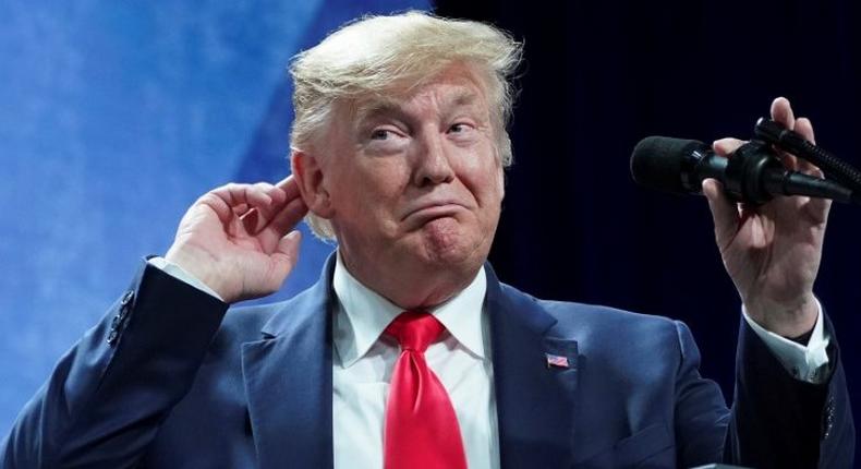 U.S. President Donald Trump  puts his hand to his head while speaking at the American Farm Bureau Federation Annual Convention and Trade Show in Austin, Texas, January 19, 2020. REUTERS/Kevin Lamarque