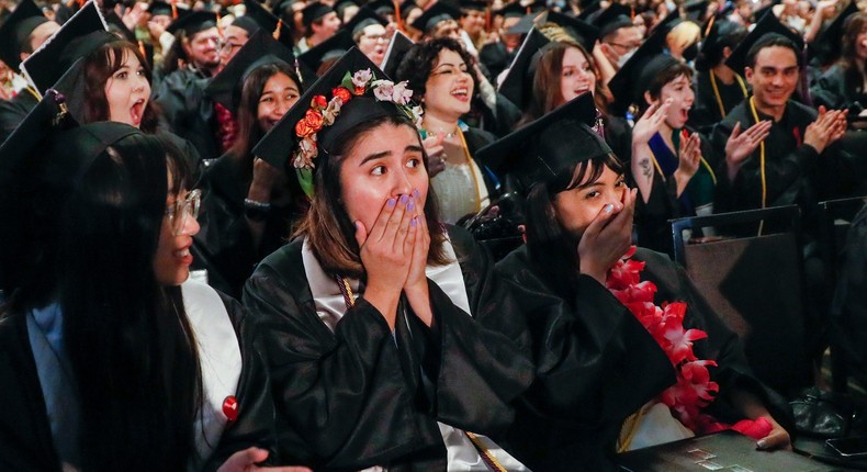 Yaritza Velazquez-Medina, center, weeps as students at Otis College of Art and Design learn they no longer have college debt.