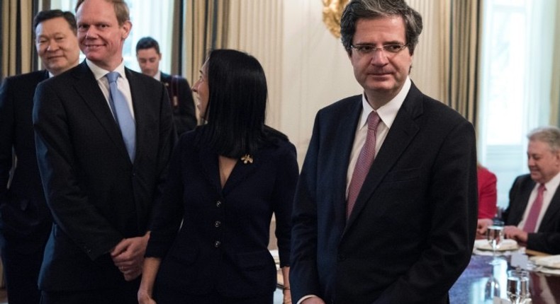 Britain's Ambassador to the United Nations Matthew Rycroft (2L) and France's Ambassador to the United National Francois Delattre (R) wait for a luncheon with UN Security Council member nations in the White House April 24, 2017 in Washington, DC