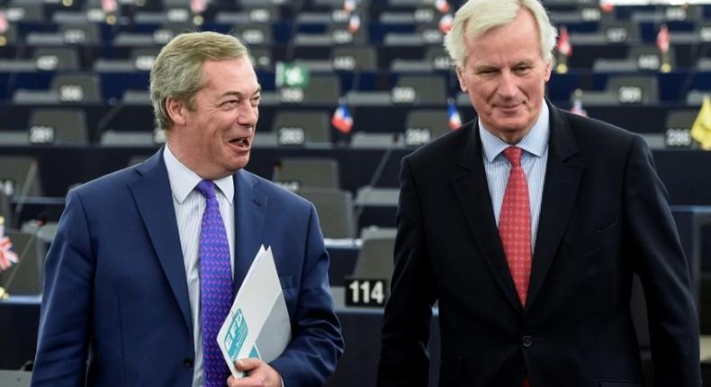 Brexit champion Nigel Farage shares a joke with Brexit negotiator Michel Barnier